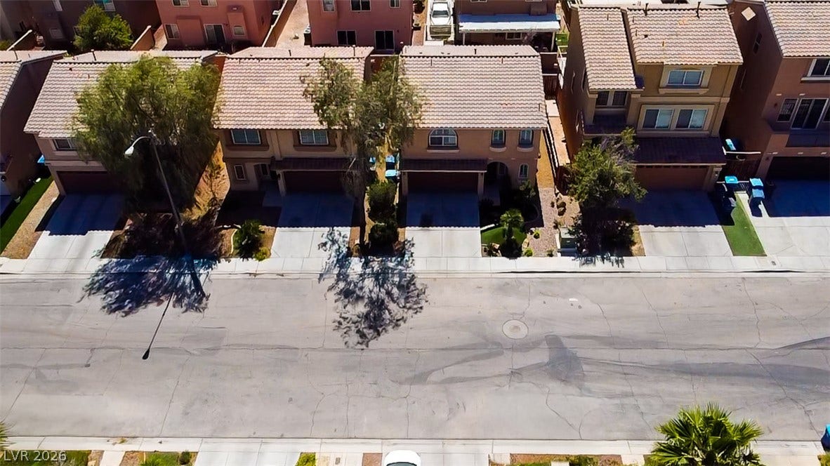 6007 Sonoma Station Avenue, Las Vegas, NV 89139 Neat suburban street views highlight the tiled rooflines and paved driveways of these residences.