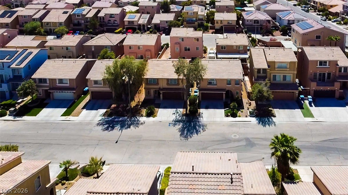 6007 Sonoma Station Avenue, Las Vegas, NV 89139 Neat suburban streetscapes highlight these multi-level homes topped with classic tile roofs.
