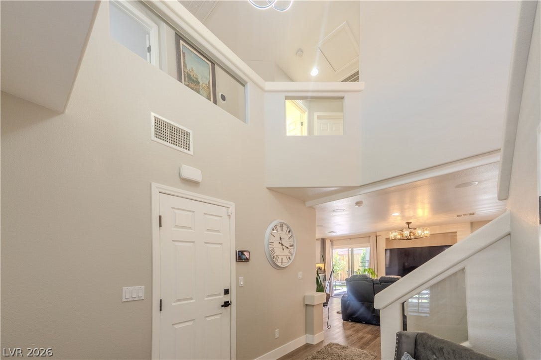 6007 Sonoma Station Avenue, Las Vegas, NV 89139 Soaring ceilings and an open-concept layout welcome guests into this light-filled entry.