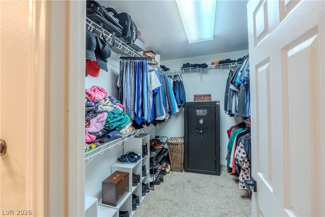 6007 Sonoma Station Avenue, Las Vegas, NV 89139 A spacious walk-in closet boasts wall-to-wall carpeting and extensive built-in wire shelving organizers.