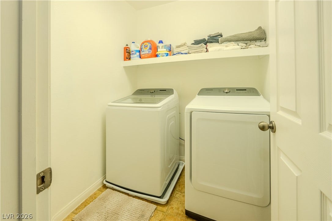 6007 Sonoma Station Avenue, Las Vegas, NV 89139 Functional utility space includes built-in shelving above laundry hookups.