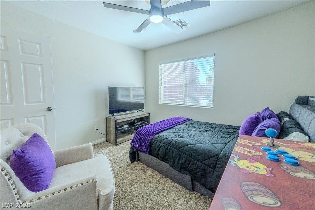 6007 Sonoma Station Avenue, Las Vegas, NV 89139 Plush carpeting and a large window create a comfortable and relaxing private bedroom.