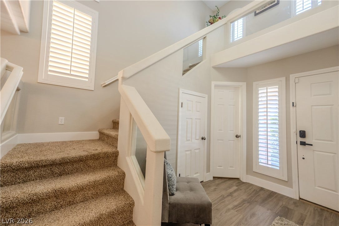 6007 Sonoma Station Avenue, Las Vegas, NV 89139 An inviting entrance foyer welcomes guests with durable flooring and a carpeted staircase.