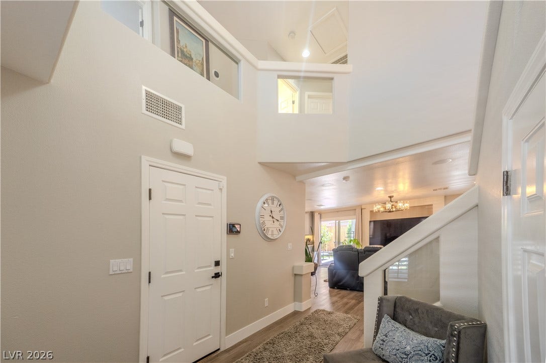 6007 Sonoma Station Avenue, Las Vegas, NV 89139 Soaring ceilings and an open-concept layout welcome guests into this light-filled entry.