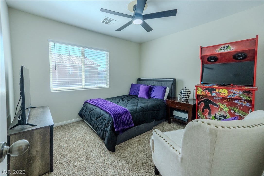 6007 Sonoma Station Avenue, Las Vegas, NV 89139 Plush carpeting and a large window create a comfortable, inviting atmosphere in this bedroom.