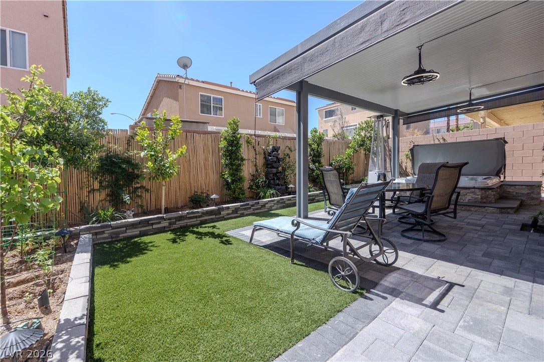 6007 Sonoma Station Avenue, Las Vegas, NV 89139 A structured patio design seamlessly integrates with manicured turf and a solid shade pavilion.