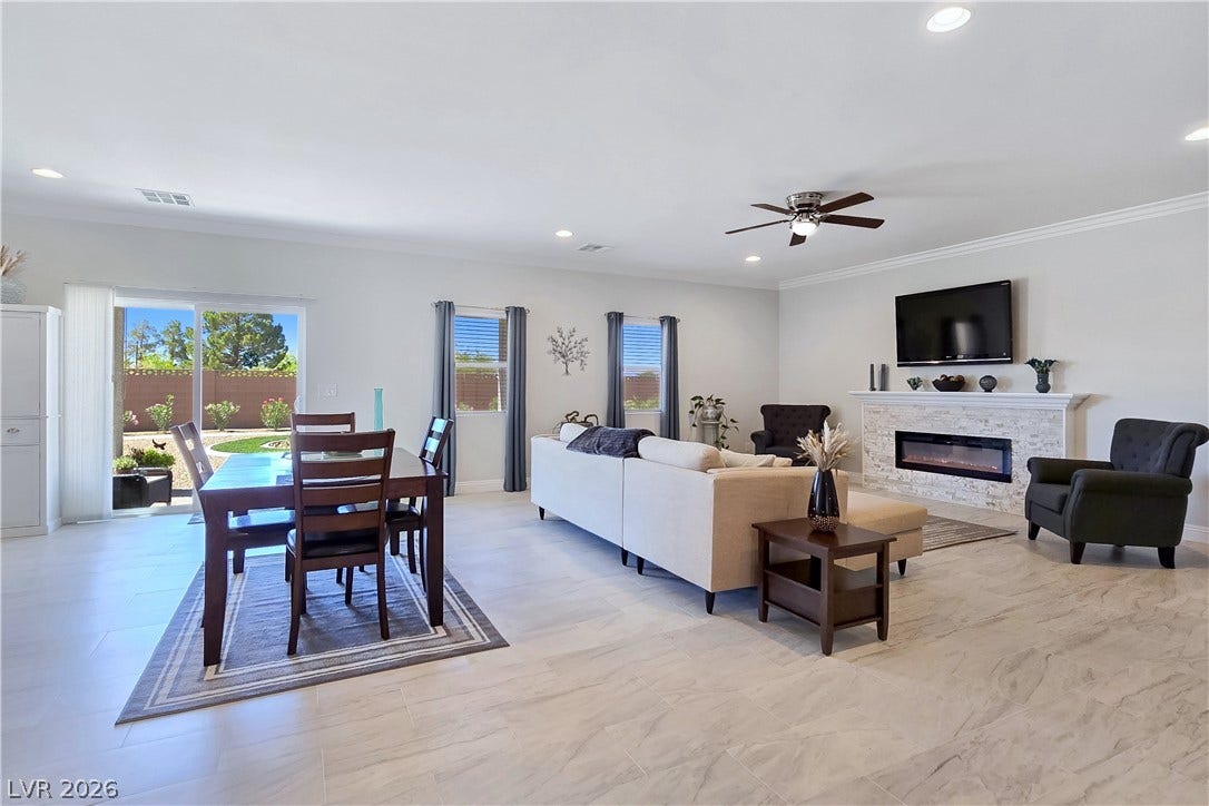 5471 Lincolnwood Court, Pahrump, NV 89061 An open floorplan design seamlessly connects the light-filled dining space to the living area.