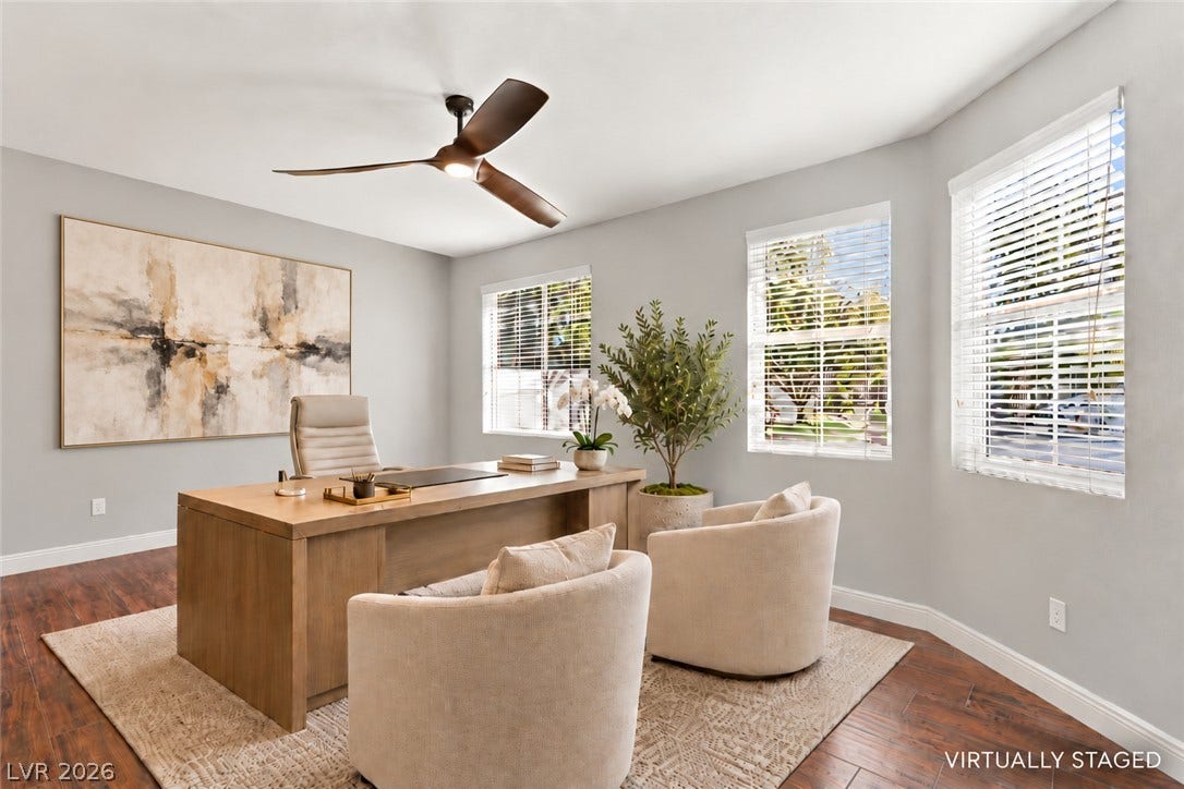 2984 Via Della Amore, Henderson, NV 89052 Rich wood flooring anchors this versatile space illuminated by multiple large windows.