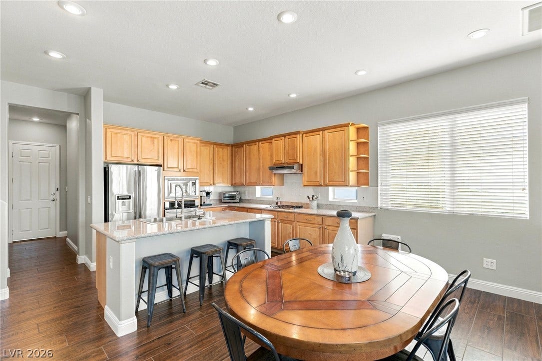 2984 Via Della Amore, Henderson, NV 89052 Recessed lighting illuminates this functional kitchen space complete with durable tile flooring and abundant cabinetry.