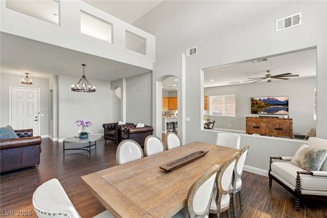 2984 Via Della Amore, Henderson, NV 89052 Gleaming hardwood floors and high ceilings define this open dining space.