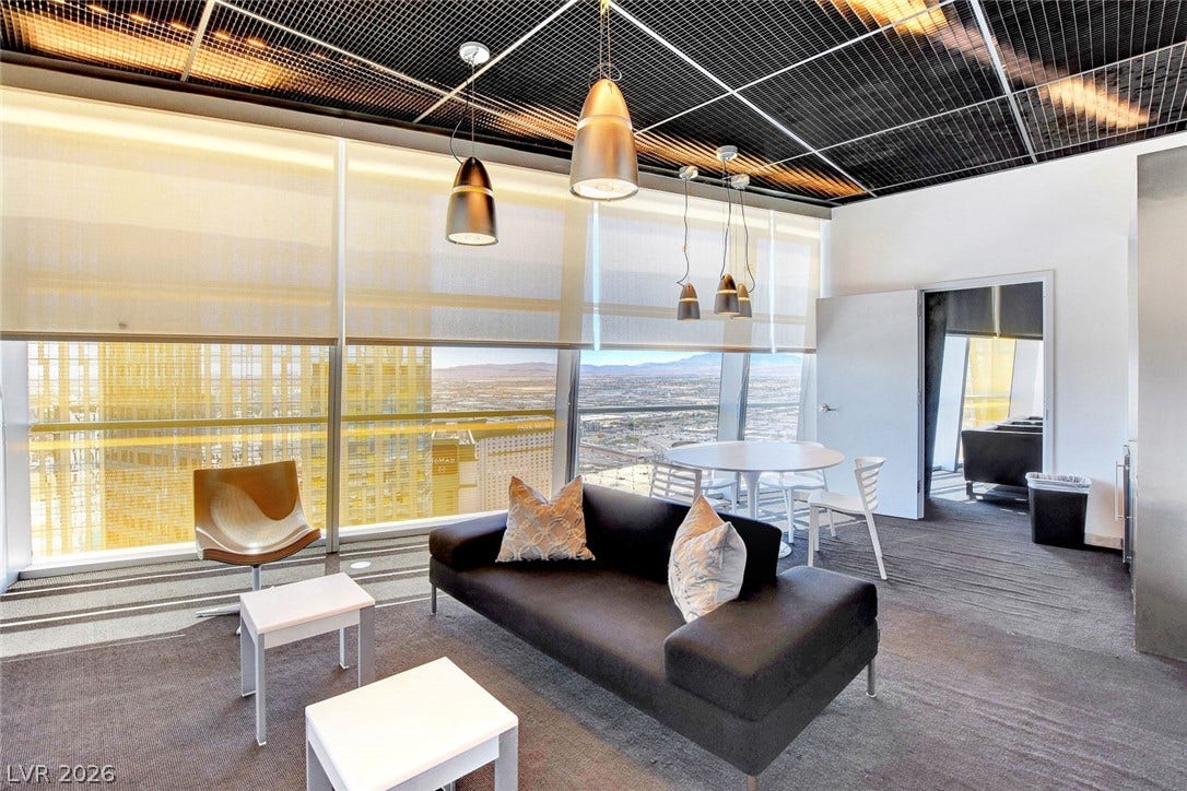 3722 Las Vegas Boulevard, #303, Las Vegas, NV 89158 Floor-to-ceiling windows frame panoramic city vistas in this modern lounge space.