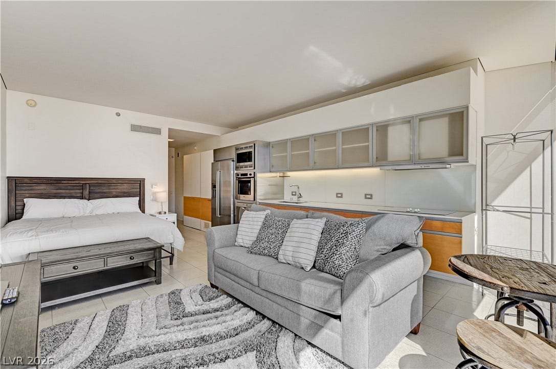 3722 Las Vegas Boulevard, #303, Las Vegas, NV 89158 A modern studio layout seamlessly combines living, sleeping, and dining spaces over tiled flooring.