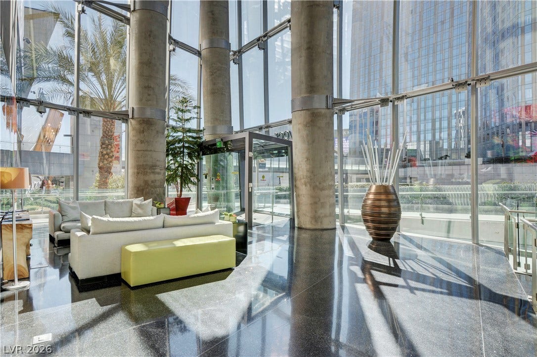 3722 Las Vegas Boulevard, #303, Las Vegas, NV 89158 Massive concrete columns and towering walls of glass frame a polished terrazzo lobby.