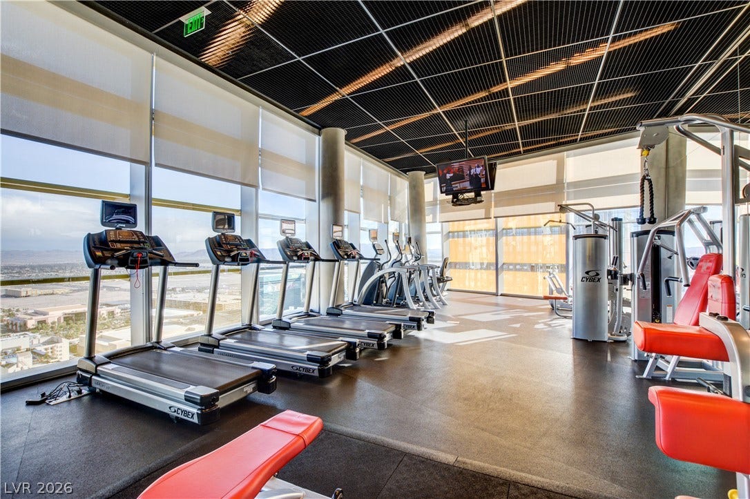 3722 Las Vegas Boulevard, #303, Las Vegas, NV 89158 Floor-to-ceiling windows flood the modern fitness facility with natural light and scenic views.