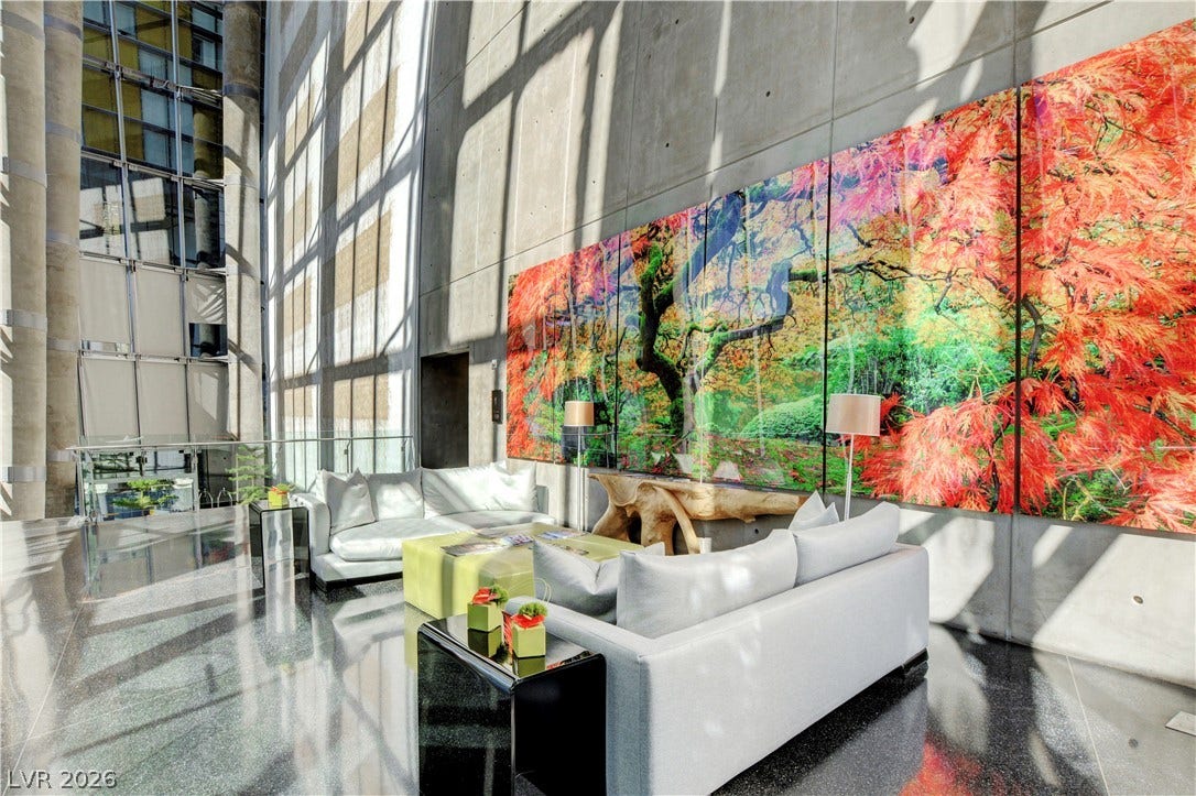 3722 Las Vegas Boulevard, #303, Las Vegas, NV 89158 Towering concrete walls and dramatic floor-to-ceiling windows define this soaring architectural atrium space.
