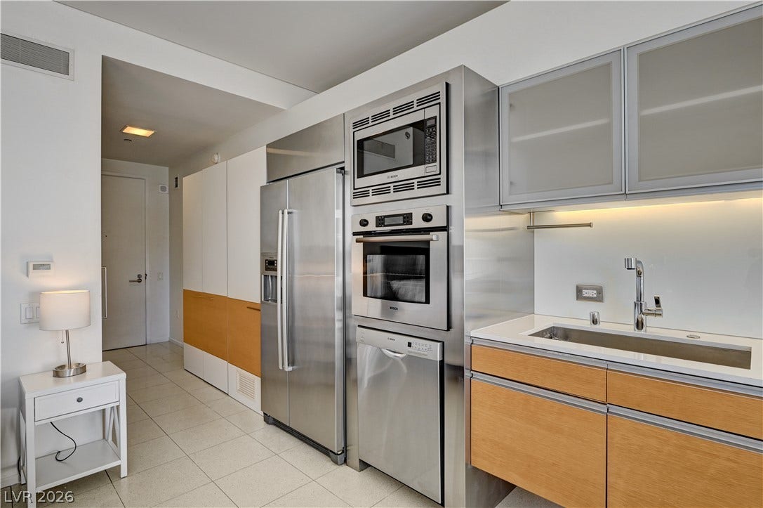 3722 Las Vegas Boulevard, #303, Las Vegas, NV 89158 Sleek modern cabinetry and integrated stainless steel appliances define this streamlined culinary space.