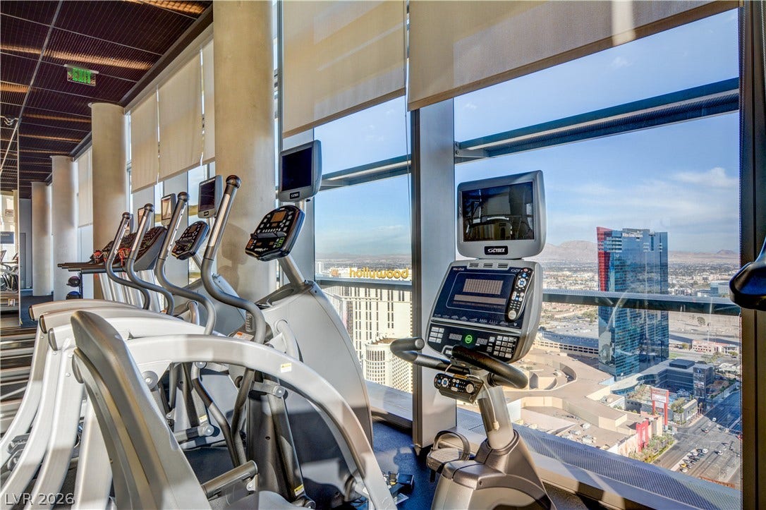 3722 Las Vegas Boulevard, #303, Las Vegas, NV 89158 Floor-to-ceiling windows offer panoramic city skyline views from the modern fitness center.