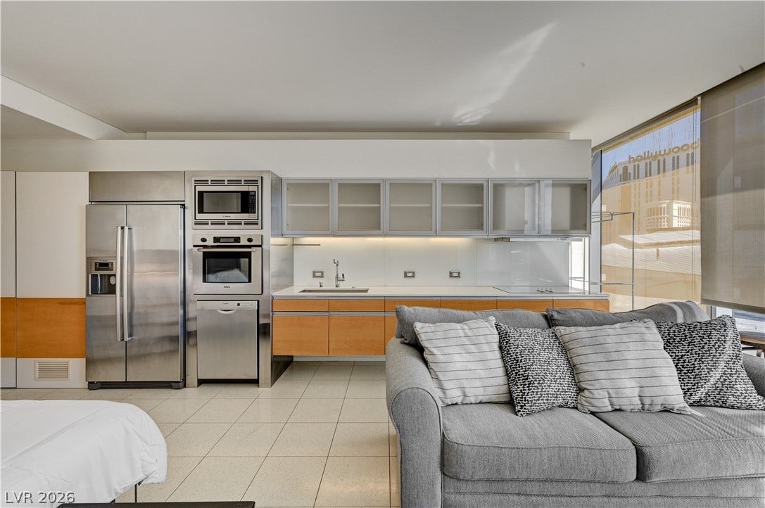 3722 Las Vegas Boulevard, #303, Las Vegas, NV 89158 Sleek minimalist kitchen spaces transition seamlessly into open concept living areas with large windows.