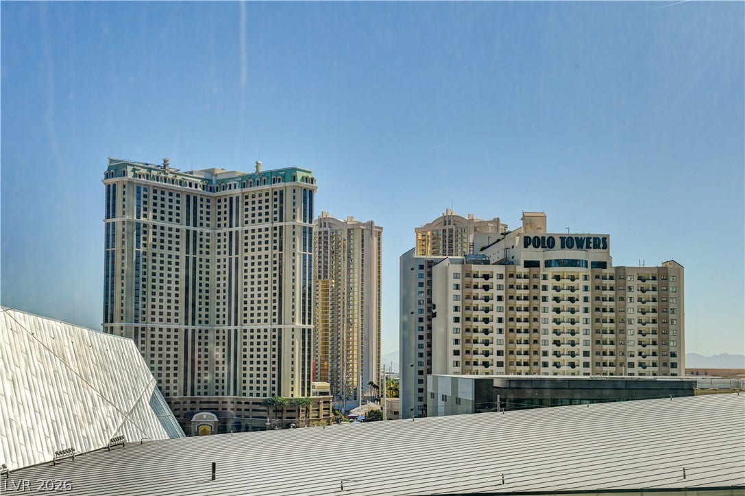 3722 Las Vegas Boulevard, #303, Las Vegas, NV 89158 Dramatic high-rise structures command the skyline view framed by a clear blue sky.