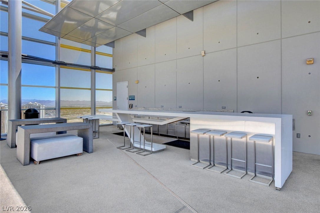3722 Las Vegas Boulevard, #303, Las Vegas, NV 89158 Floor-to-ceiling windows look out over the distant landscape in this modern entertainment space.