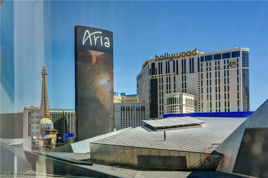 3722 Las Vegas Boulevard, #303, Las Vegas, NV 89158 Dynamic city views frame iconic landmarks against a clear desert sky.