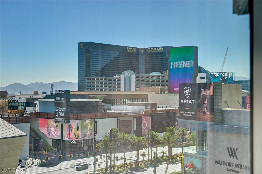 3722 Las Vegas Boulevard, #303, Las Vegas, NV 89158 Vibrant city views overlook the bustling streetscape and iconic skyline landmarks.