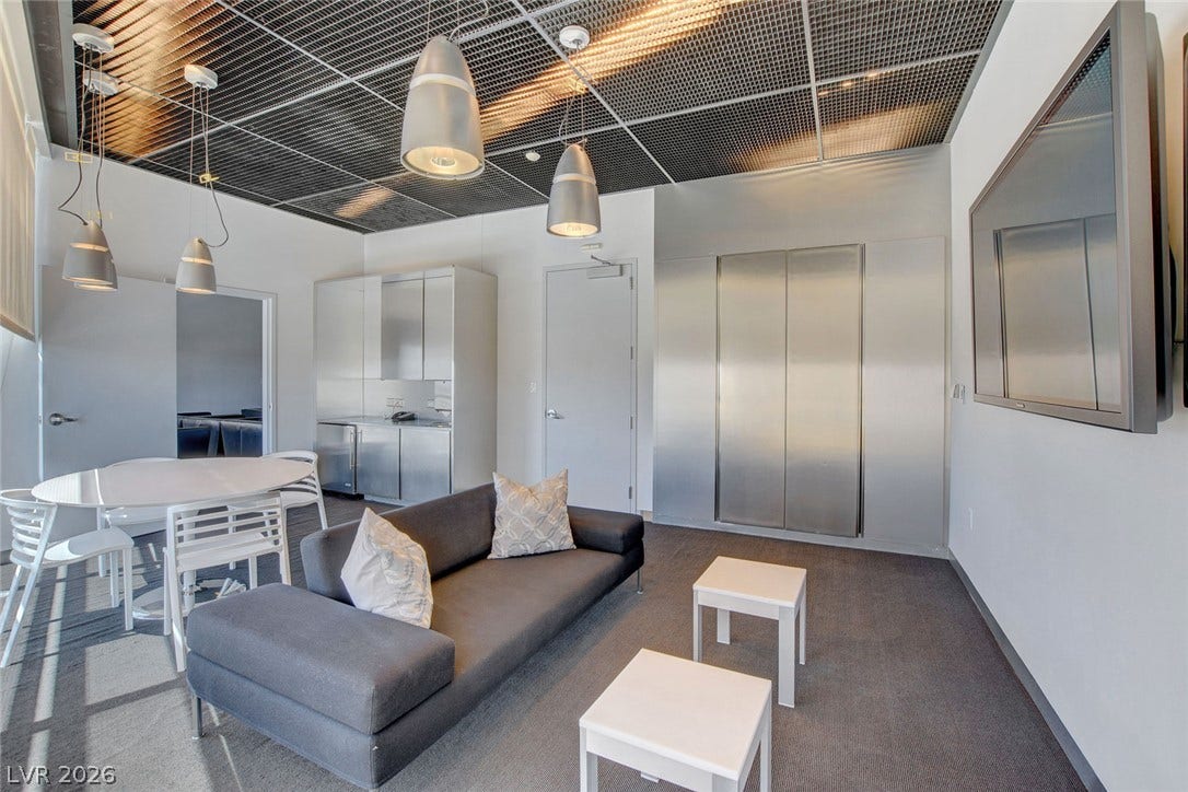3722 Las Vegas Boulevard, #303, Las Vegas, NV 89158 Industrial style elements pair with sleek metal surfaces in this open concept living space.