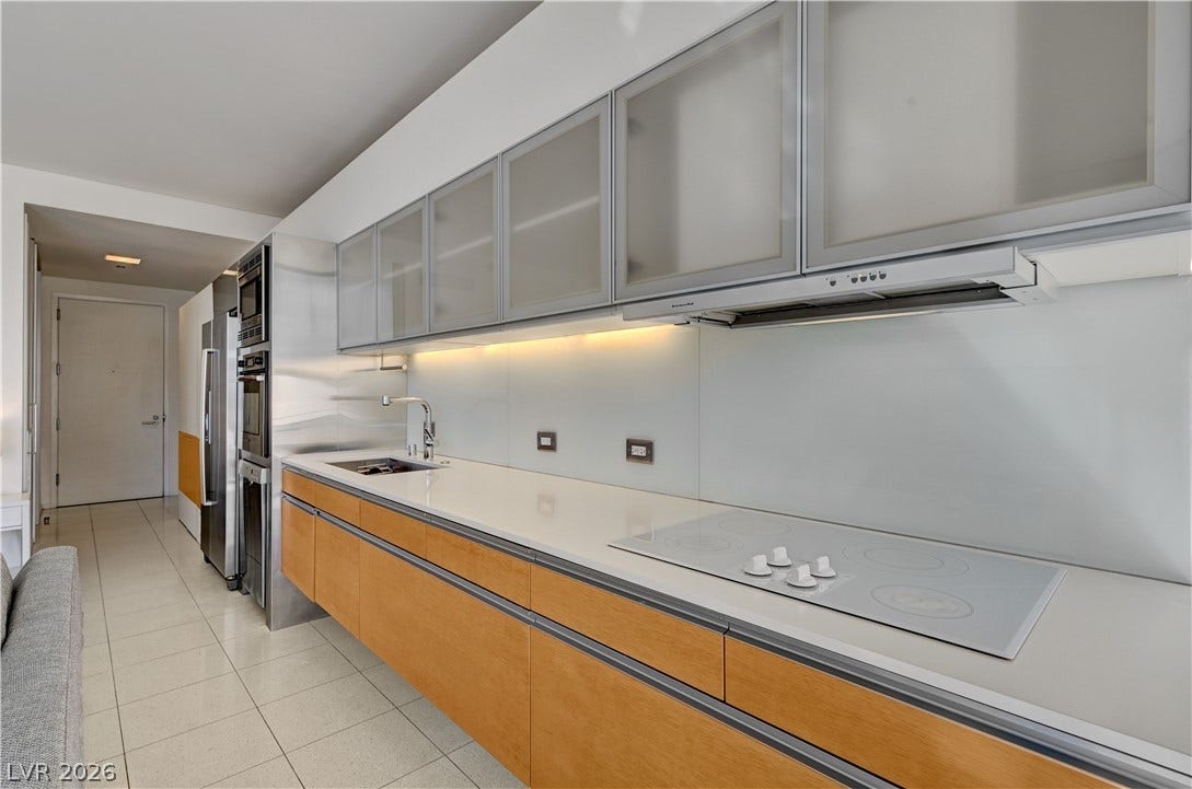 3722 Las Vegas Boulevard, #303, Las Vegas, NV 89158 Sleek contemporary cabinetry and solid countertops define this streamlined gourmet kitchen workspace.