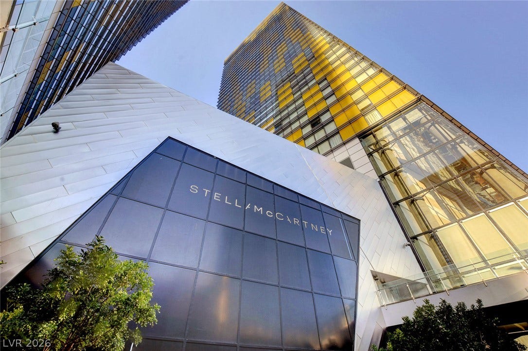 3722 Las Vegas Boulevard, #303, Las Vegas, NV 89158 Dramatic modern architecture rises into the sky above a sleek glass storefront.
