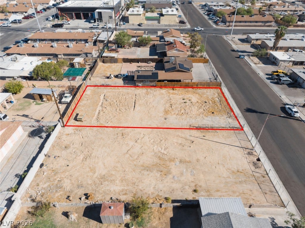 2321 McCarran Street, North Las Vegas, NV 89030 A spacious level lot outlined in red sits ready for development near local roads.