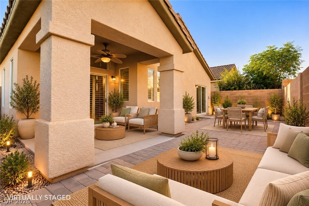 6729 Quarterhorse Lane, Las Vegas, NV 89148 A spacious covered patio integrates seamlessly with the surrounding paved courtyard. *Virtually Staged*