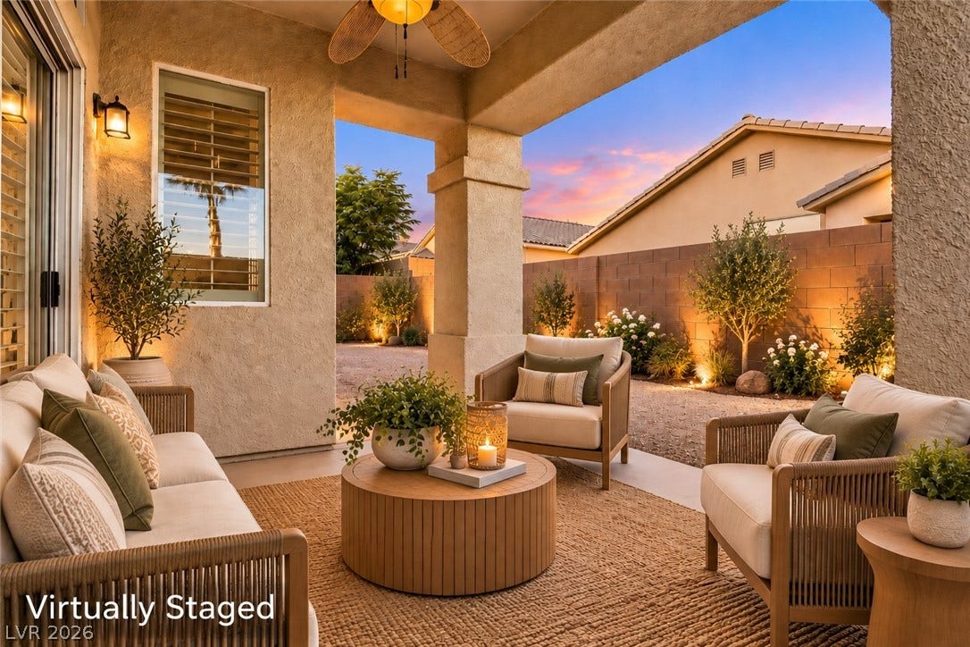 6729 Quarterhorse Lane, Las Vegas, NV 89148 Covered outdoor living space looks out over a private backyard with neat landscaping. *Virtually Staged*