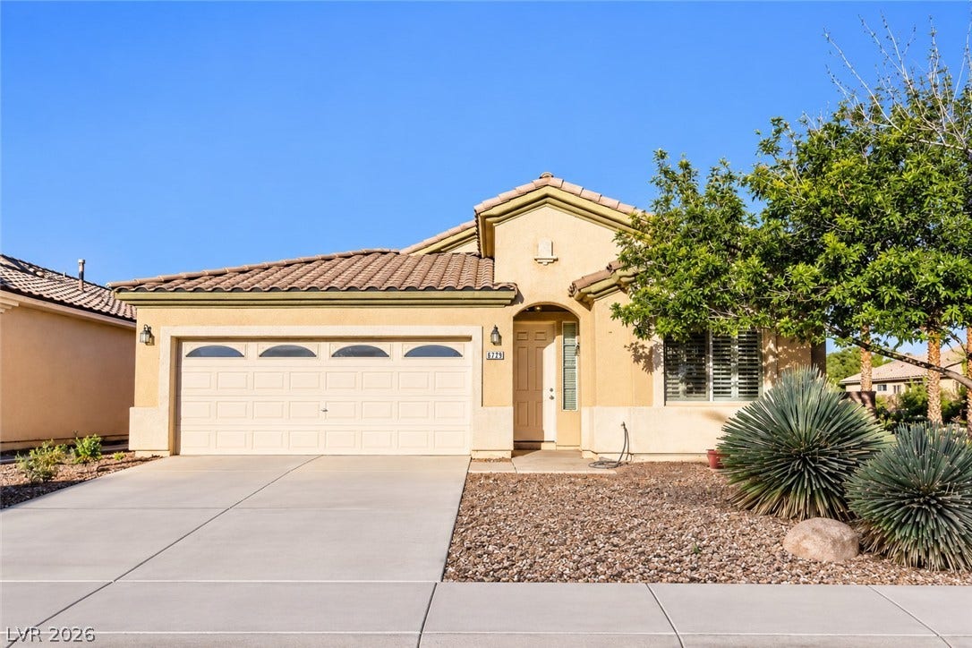 6729 Quarterhorse Lane, Las Vegas, NV 89148 Charming single-story home situated on a desirable corner lot with no HOA, featuring a two-car garage, tile roof, low-maintenance desert landscaping, mature trees, and a spacious driveway.