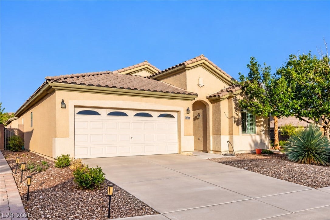 6729 Quarterhorse Lane, Las Vegas, NV 89148 Beautiful single-story exterior showcasing a spacious corner lot, attached two-car garage, tile roof, stucco finish, mature desert landscaping, and plenty of parking.