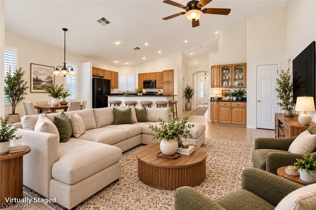 6729 Quarterhorse Lane, Las Vegas, NV 89148 An airy open layout integrates the living area with the kitchen beneath high vaulted ceilings. *Virtually Staged*
