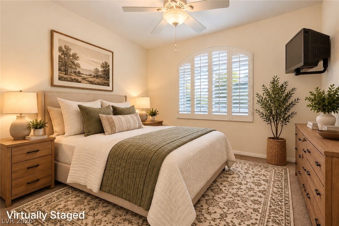 6729 Quarterhorse Lane, Las Vegas, NV 89148 An arched window with plantation shutters anchors this comfortable bedroom space. *Virtually Staged*