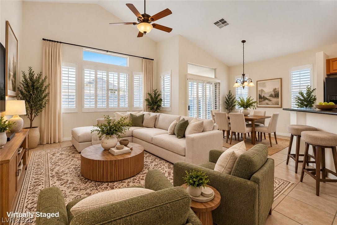 6729 Quarterhorse Lane, Las Vegas, NV 89148 Vaulted ceilings and tile flooring enhance this open-concept main living area. *Virtually Staged*