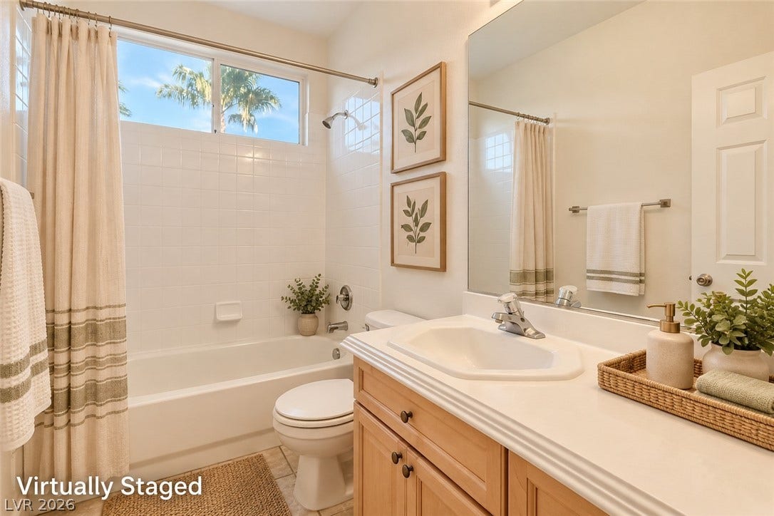 6729 Quarterhorse Lane, Las Vegas, NV 89148 Clean lines and a functional layout define this refreshing bathroom complete with a tiled tub shower. *Virtually Staged*