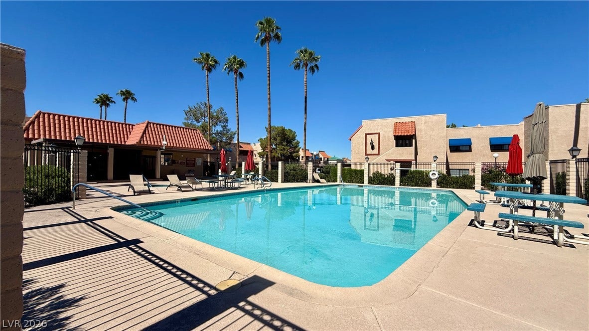 4321 Gannet Circle, #199, Las Vegas, NV 89103 Sun-drenched community pool area offers refreshing outdoor recreation under clear desert skies.