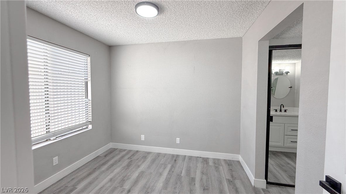 4321 Gannet Circle, #199, Las Vegas, NV 89103 Smooth wood-look flooring and crisp trim define this versatile room with an adjacent vanity area.