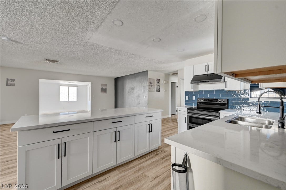 4442 Eureka Circle, Las Vegas, NV 89103 An open floorplan seamlessly connects the updated kitchen to adjacent living spaces.