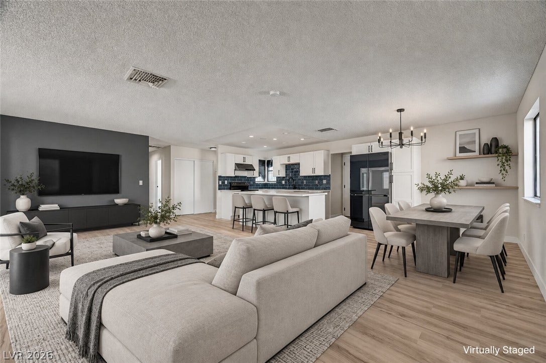 4442 Eureka Circle, Las Vegas, NV 89103 Clean lines and smooth flooring define this light-filled open concept living area.