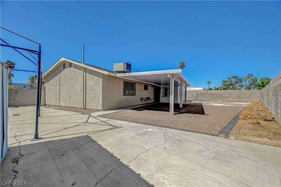 4442 Eureka Circle, Las Vegas, NV 89103 A spacious backyard patio area sits adjacent to a low-maintenance paved rear yard.