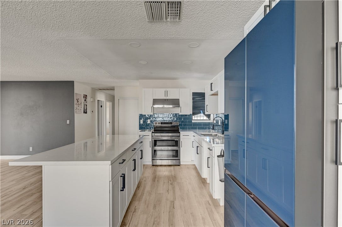 4442 Eureka Circle, Las Vegas, NV 89103 An open floorplan design connects this modern workspace seamlessly to adjoining living areas.