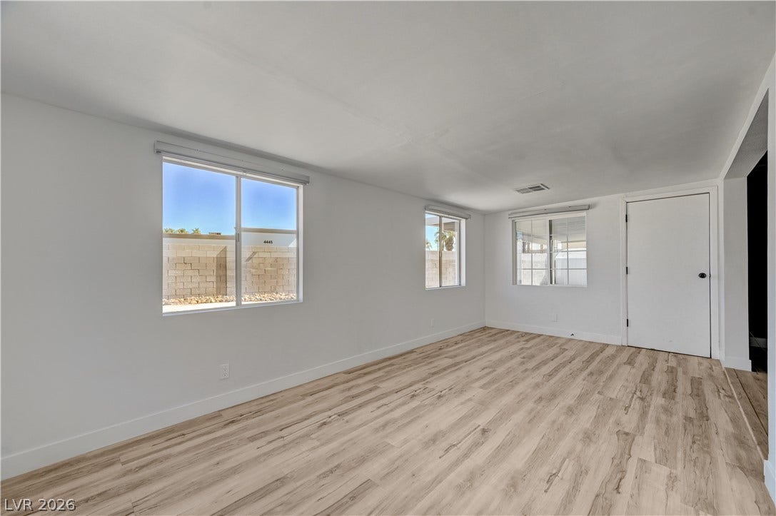 4442 Eureka Circle, Las Vegas, NV 89103 Clean lines and durable wood-look flooring define this versatile, light-filled living area.