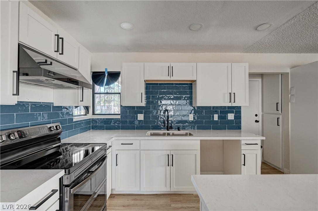 4442 Eureka Circle, Las Vegas, NV 89103 Gleaming stone countertops and a glossy tile backsplash define this updated culinary space.