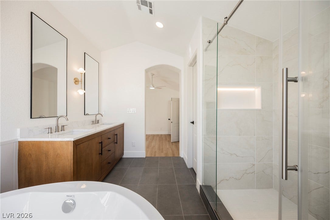 Clean lines and a freestanding tub define this contemporary primary bathroom retreat.