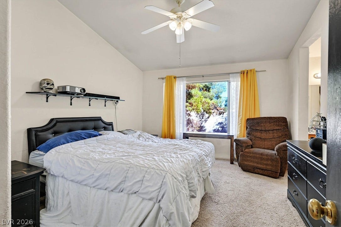 8830 Haviland Road, Las Vegas, NV 89123 Soft carpeting underfoot and vaulted ceilings elevate this relaxing secondary bedroom.
