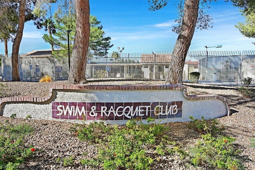 8830 Haviland Road, Las Vegas, NV 89123 Mature trees frame the secure gated entrance to the community recreation facilities.