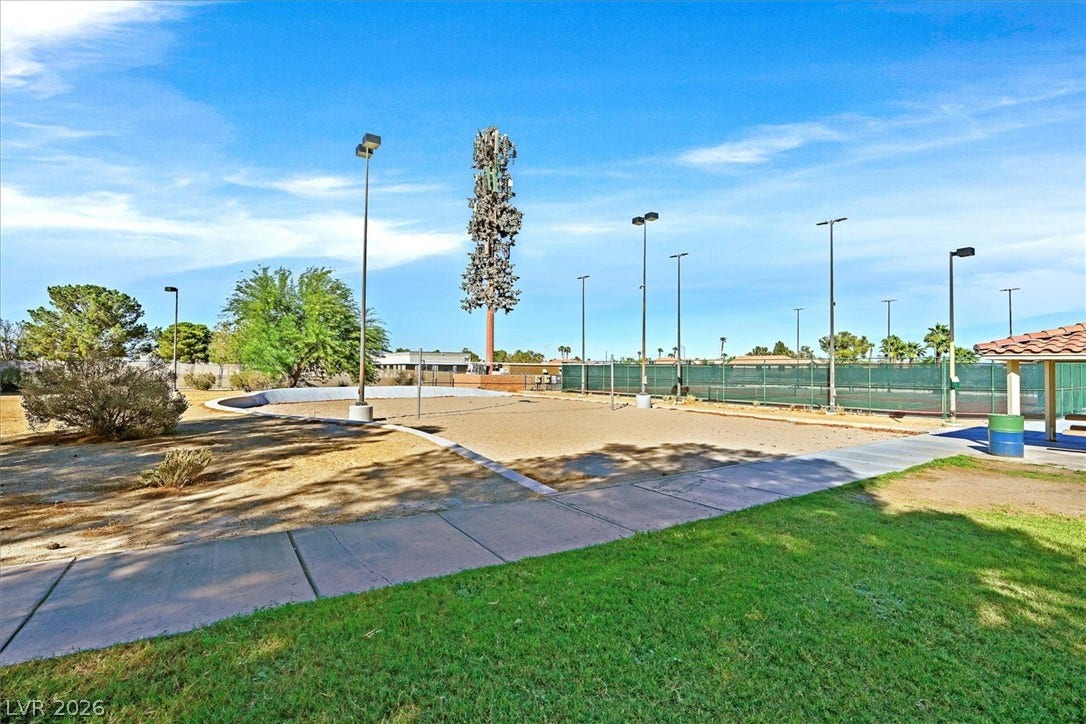 8830 Haviland Road, Las Vegas, NV 89123 Concrete walkways border outdoor recreation courts set against a clear blue sky.